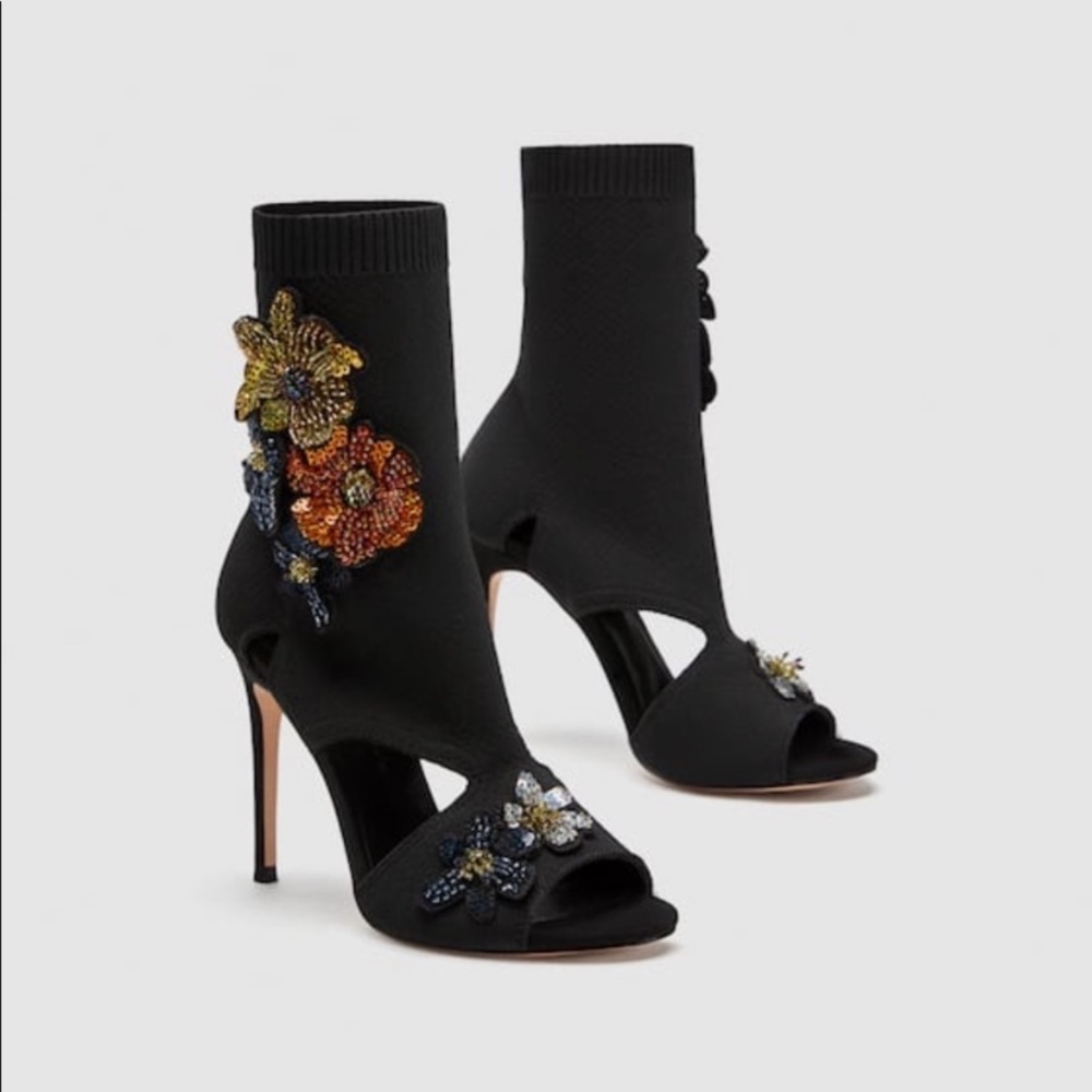 High heel sock-style sandals with flowers